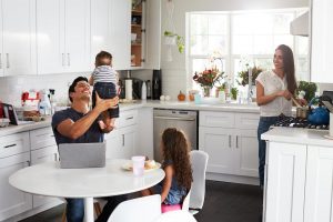 Young family spending time in newly refreshed kitchen