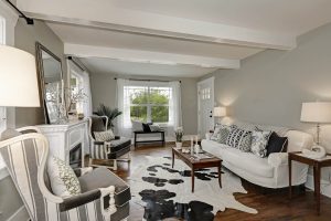 The interior of a living room with gray walls.