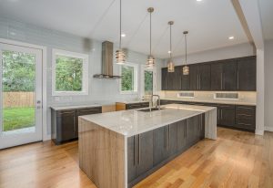 Sleek kitchen with light grey walls